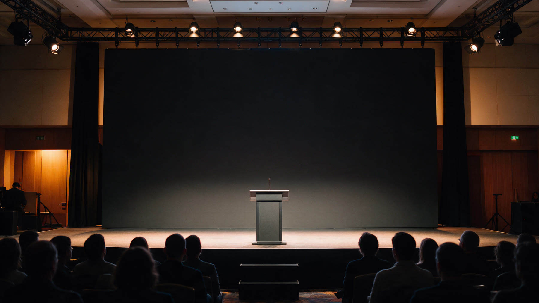 Conference stage with the LuminaTech logo on the LED wall